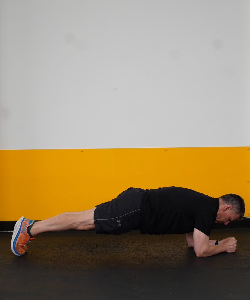 man performing plank exercise