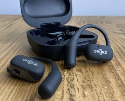 Sports earphones and case on a table