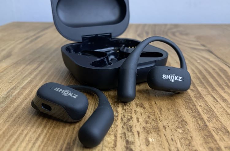 Sports earphones and case on a table