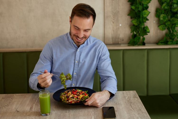 Man eating a healthy looking meal