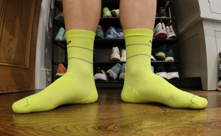 Close-up of a man's feet wearing running socks