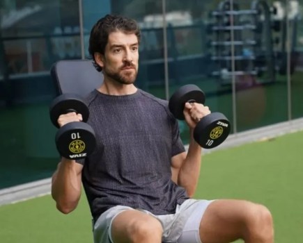 Close-up of a man performing a dumbbell hammer curl