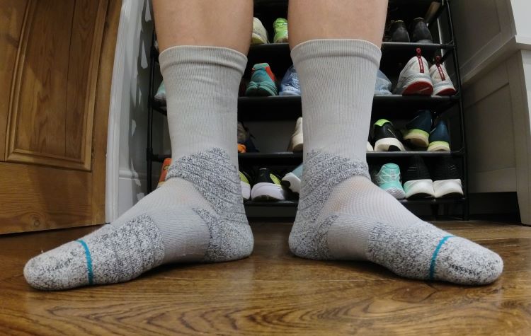 Close-up of a man's feat wearing running socks