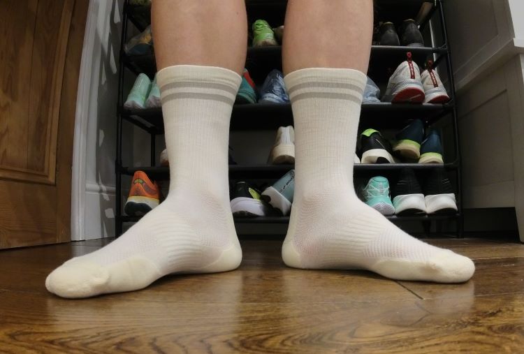 Close-up of a man's feet wearing Tracksmith running socks
