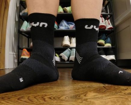 Close-up of a man's feet wearing UYN running socks