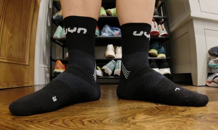 Close-up of a man's feet wearing UYN running socks