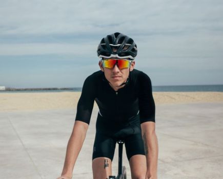 Front-on view of a man riding with cycling glasses