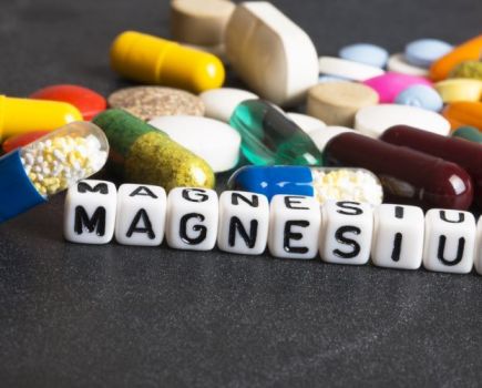Selection of pills and supplements above the word 'magnesium'