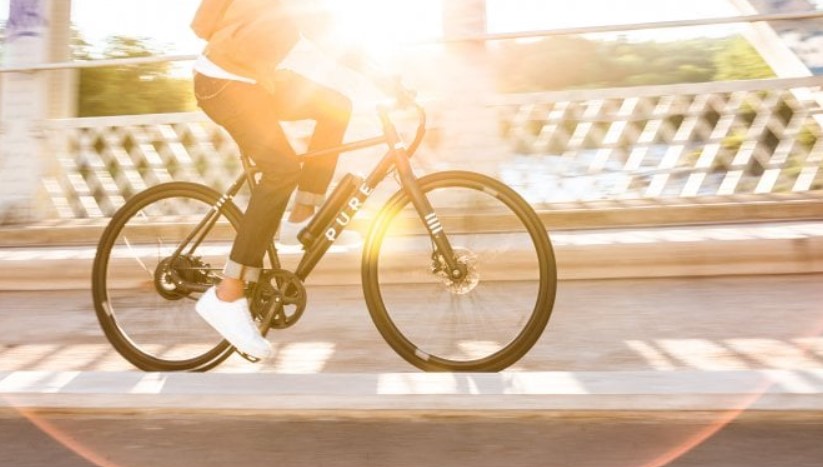 Close-up of a man commuting by e-bike
