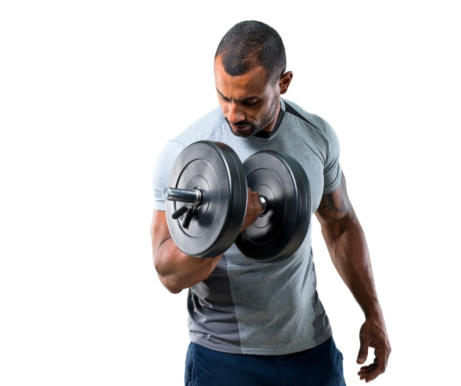 athletic man curling a dumbbell