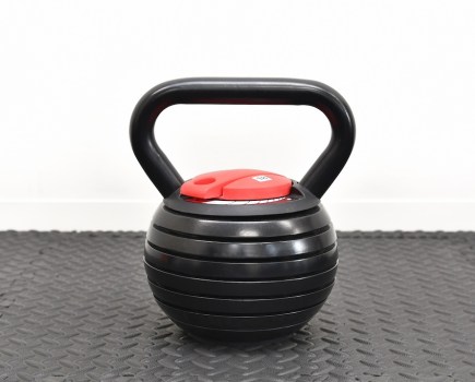 adjustable kettlebell on gym floor