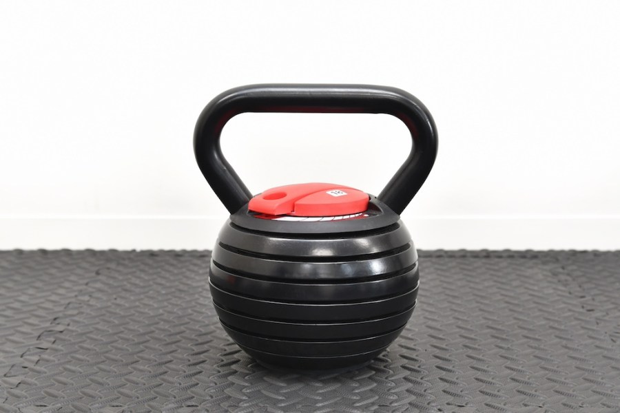 adjustable kettlebell on gym floor