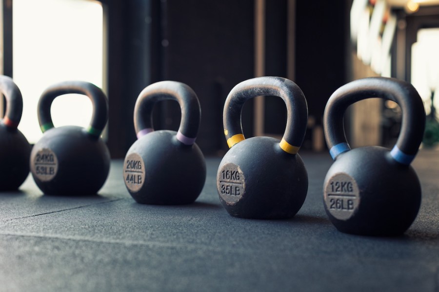 Different kettlebells lined up in a row