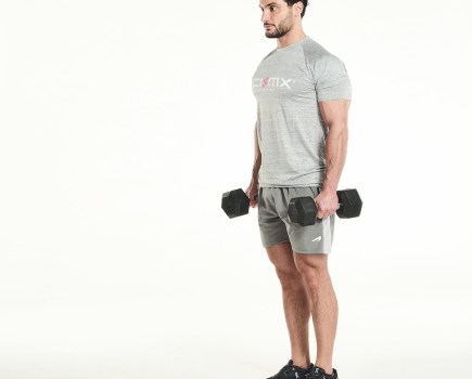 Davide Sanclimenti holding a dumbbell in each hand