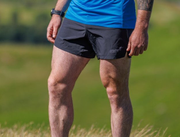 Lower torso shot of a main wearing running shorts