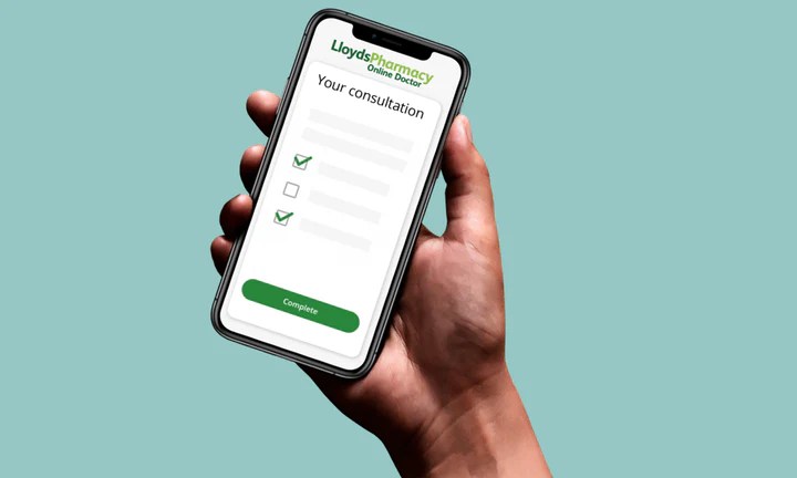 hand holding phone with LloydsPharmacy online doctor displayed on screen