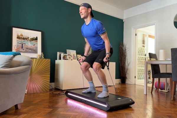 Men's Fitness product reviewer Kieran Alger testing the Vitruvian Trainer+ home workout machine