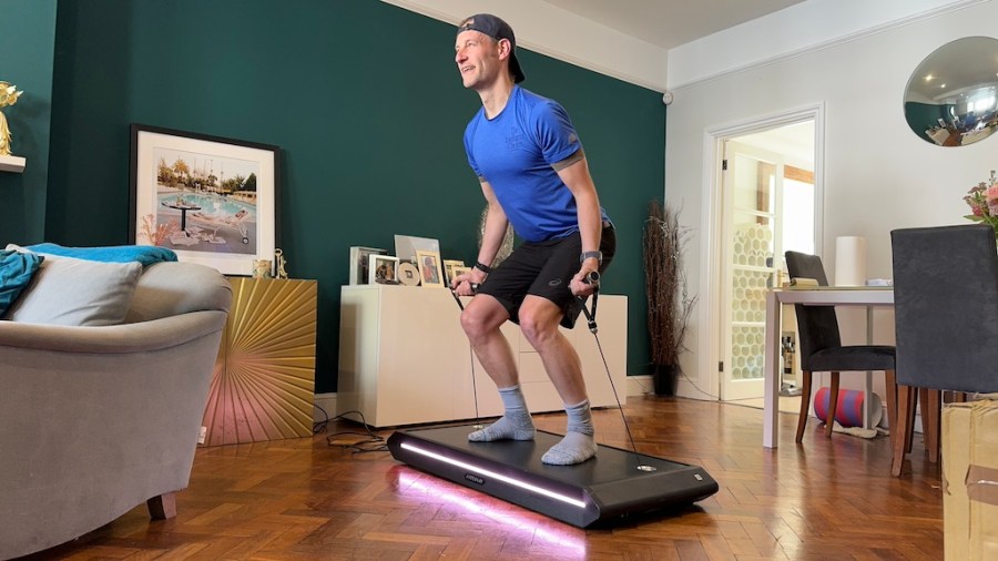 Men's Fitness product reviewer Kieran Alger testing the Vitruvian Trainer+ home workout machine
