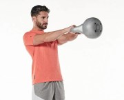 Man performing a kettlebell swing