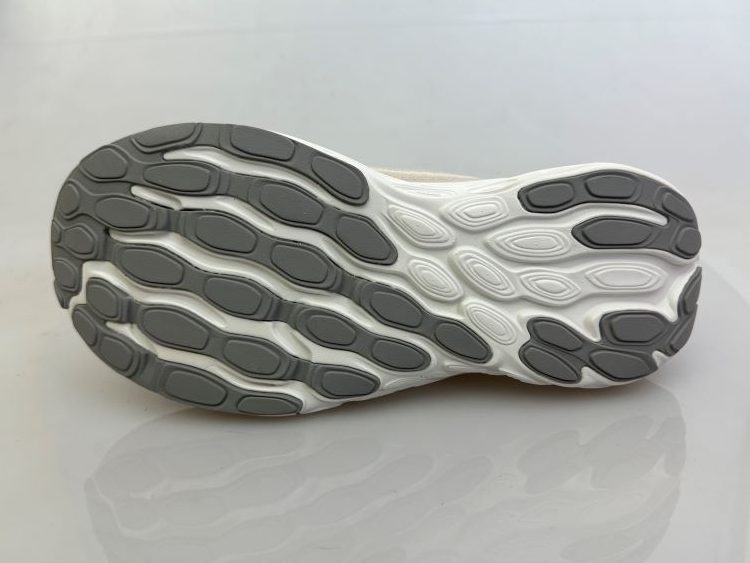 Product shot of the sole of NB running shoes