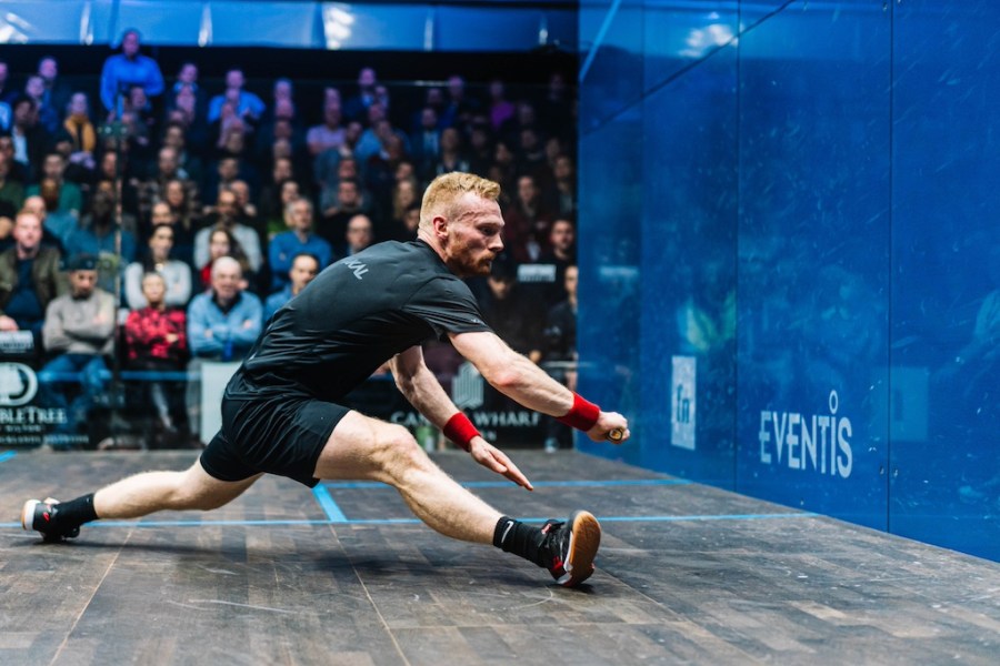 squash player Joel Makin lunges for a ball
