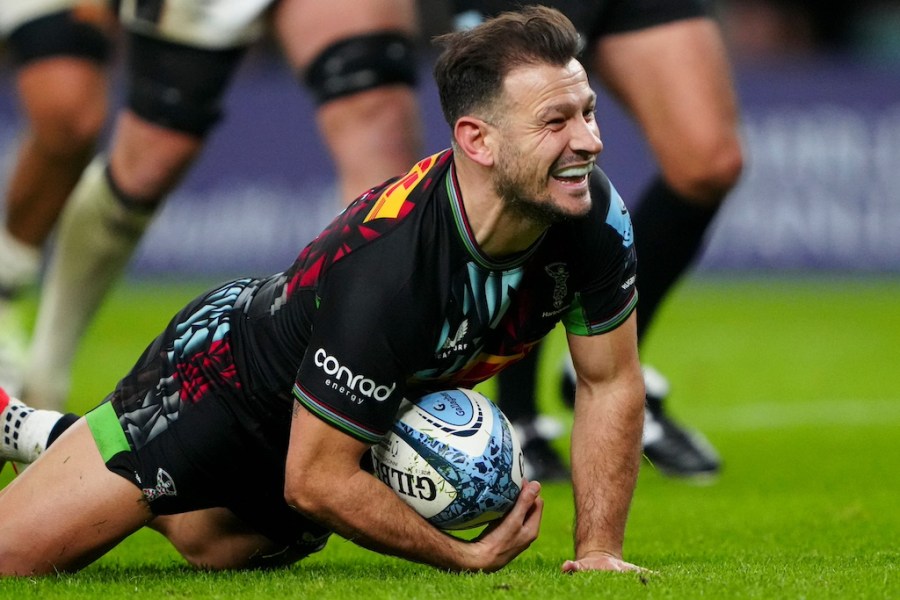 Rugby player Danny Care smiles as he scores a try