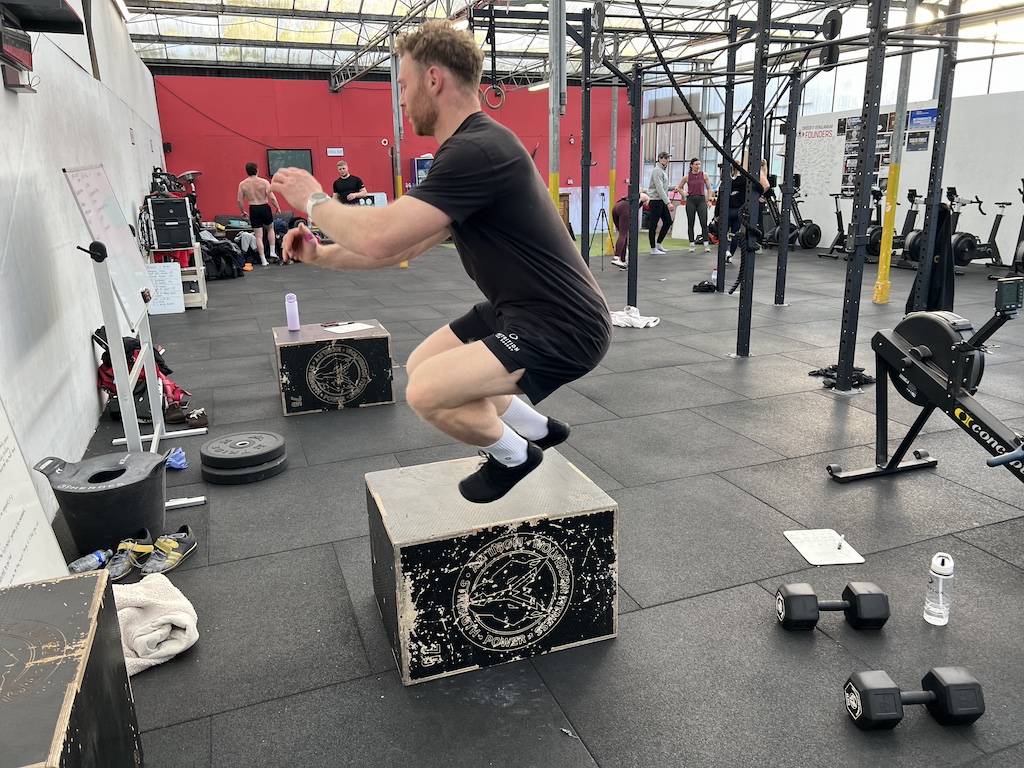 Men's Fitness product tester James Hudson jumps on a box while reviewing the inov8 Bare-XF gym shoe