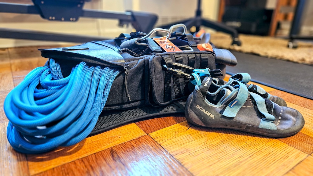 KNKG Backpack on the floor with climbing gear attached to it