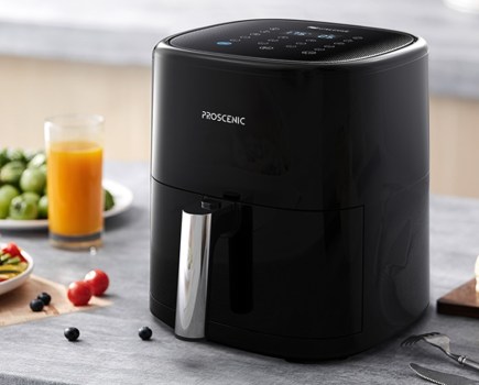 Product shot of an air fryer on a kitchen worktop