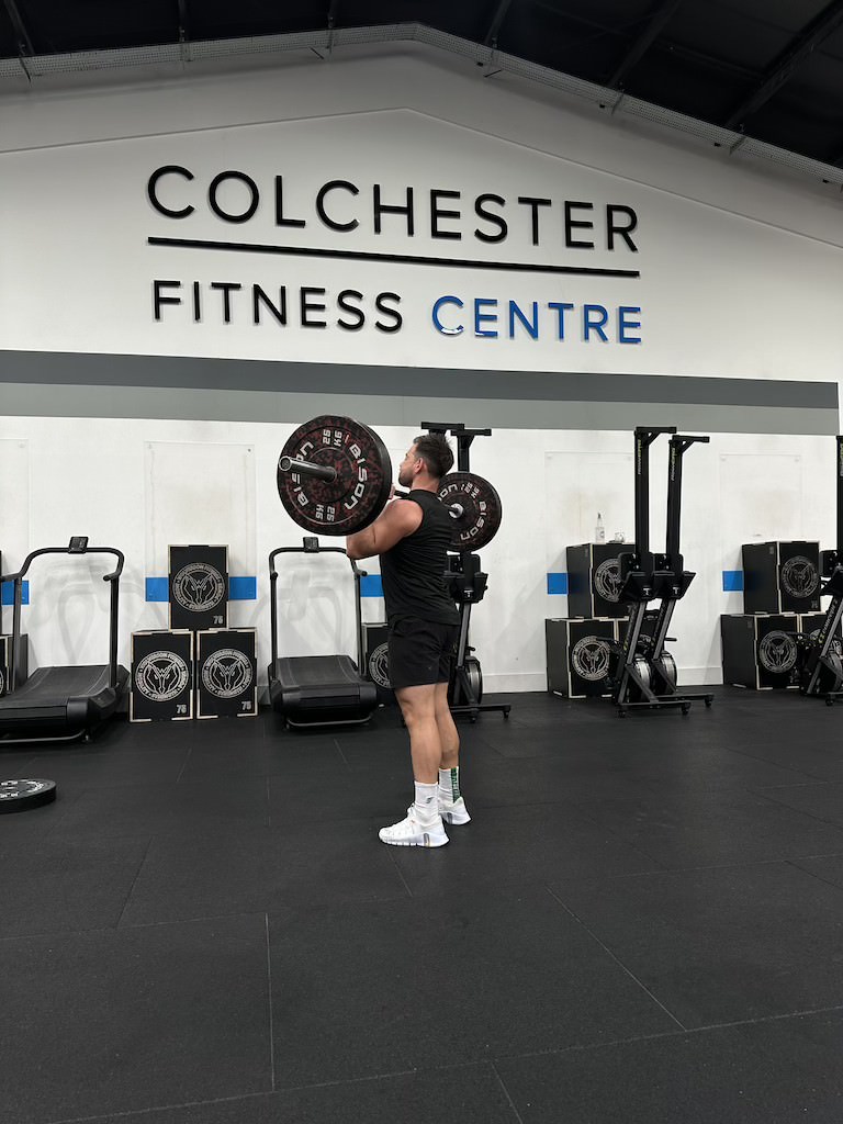 PT Harvey Lawton demonstrating how to do a barbell strict press