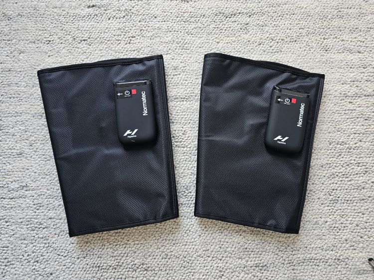 Product shot of a pair of compression sleeves and their controls