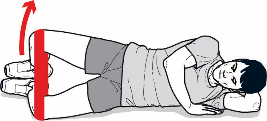 man performing clam shell exercise as part of an American football workout