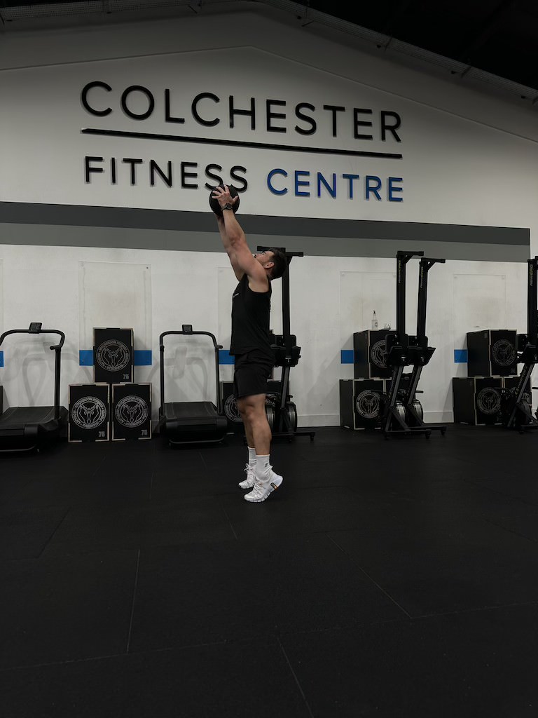 PT Harvey Lawton demonstrating how to do a medicine ball scoop throw