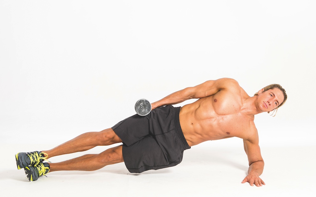 topless fitness model performing dumbbell side plank with lateral raise