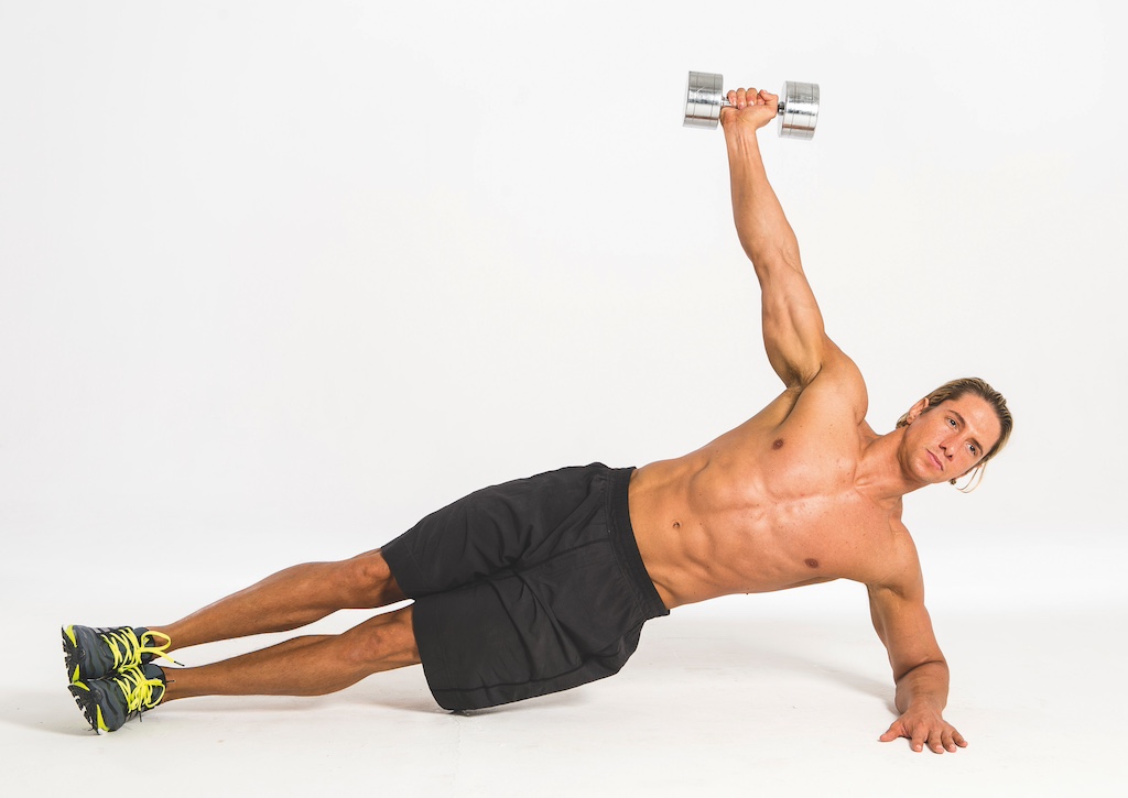 topless fitness model performing dumbbell side plank snatch as part of a dumbbell abs workout