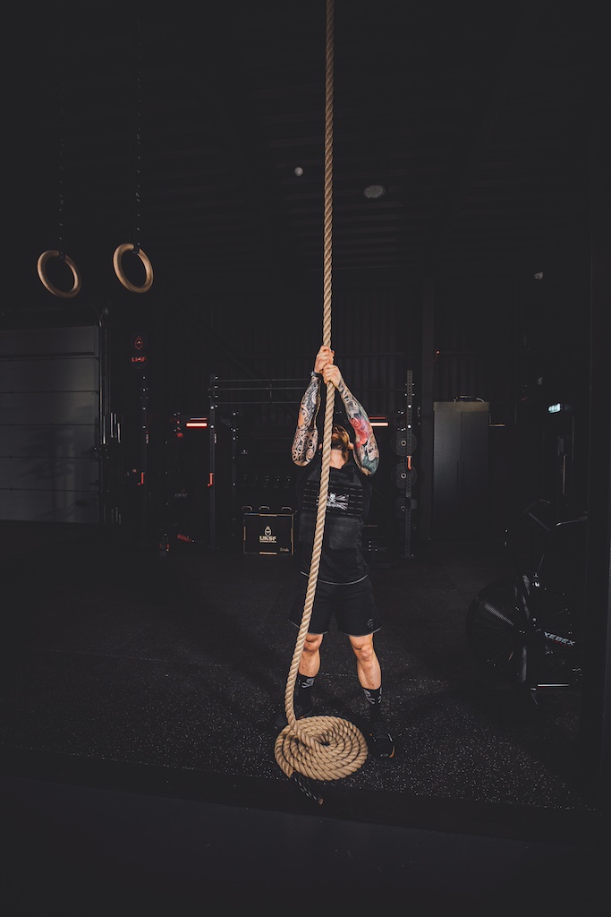 Anthony Stazicker demonstrating how to do a rope climb