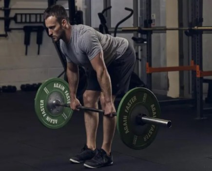 Man performing a a barbell bent-over row