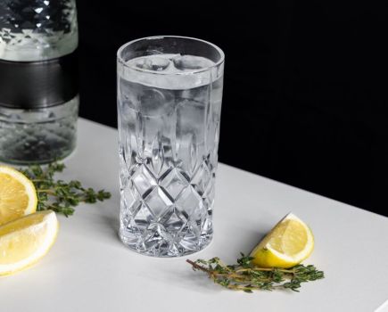 Glass of water on table with lemons