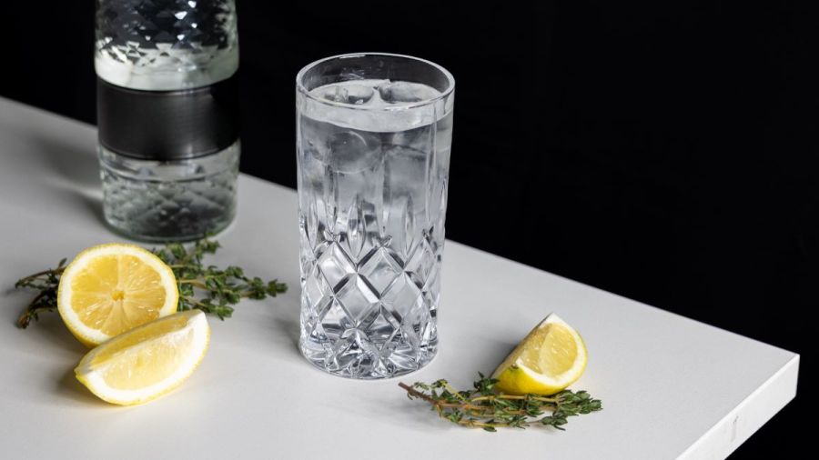 Glass of water on table with lemons