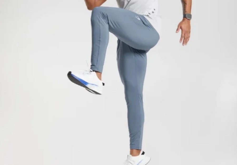 Lower torso of a man wearing gym joggers