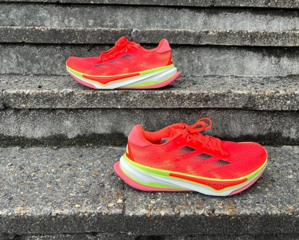 A pair of running shoes sitting on stone steps