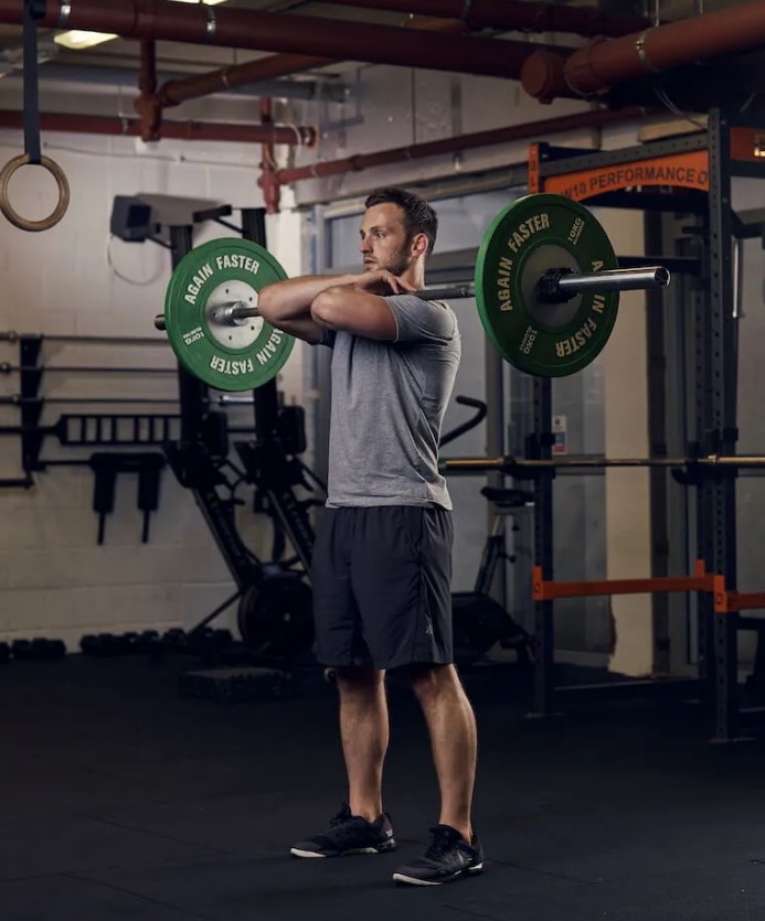 Man performing a barbell front squat