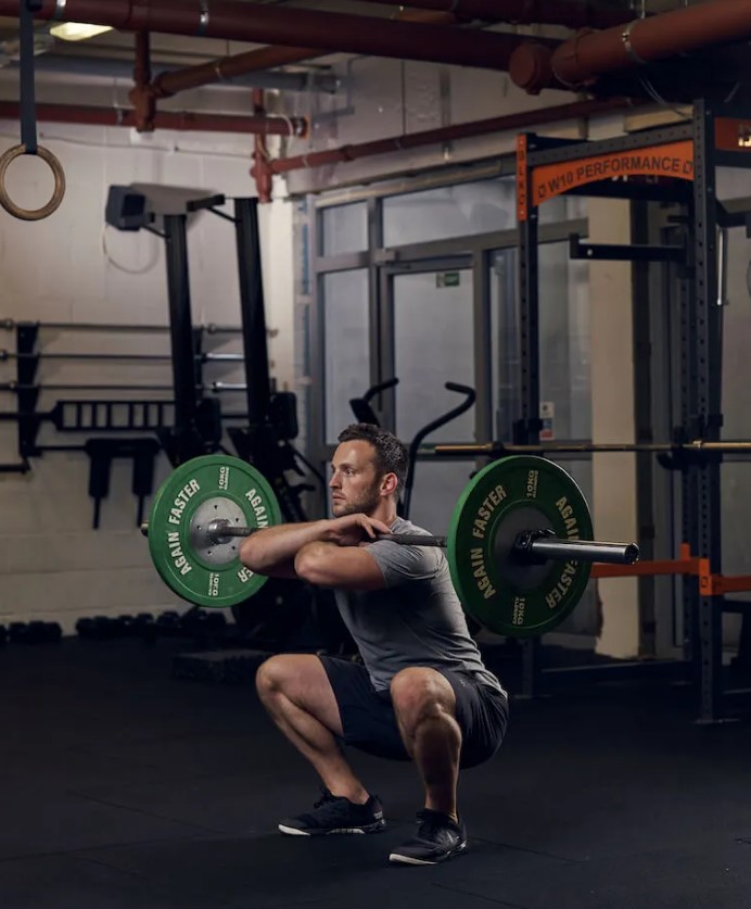Man performing a barbell front squat