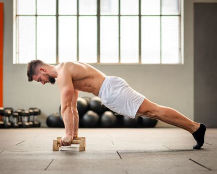 Bare-chested man performing push-ups