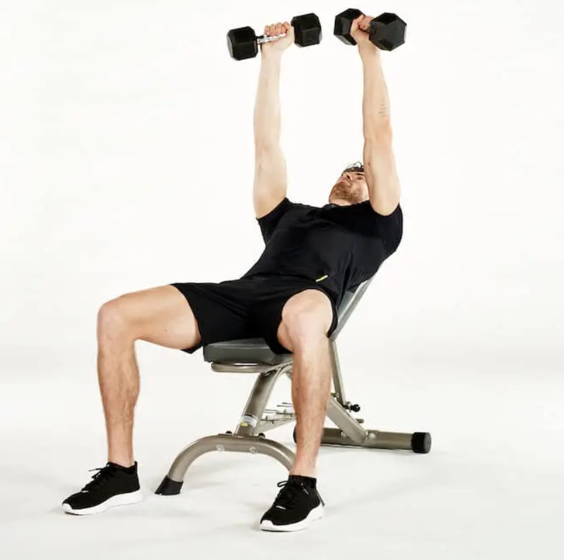 Man performing an incline bench press
