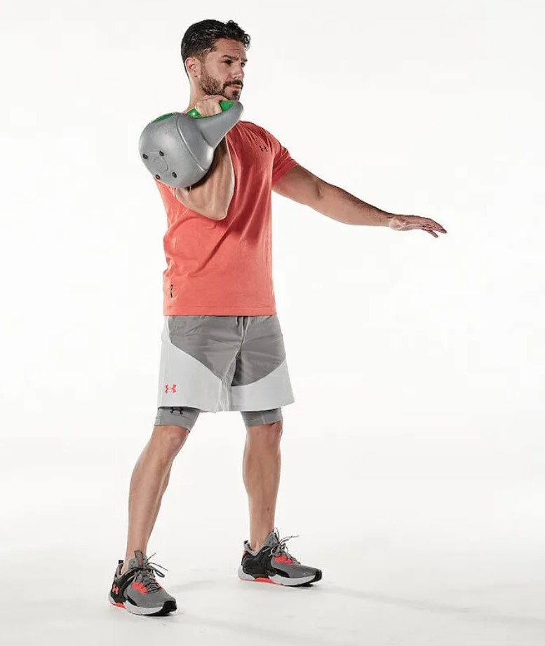 Man performing the kettlebell clean and press