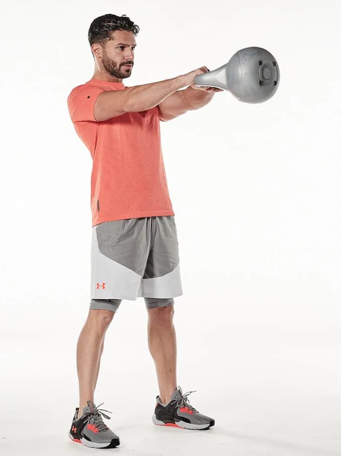 Man performing a kettlebell workout