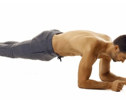 man performing plank exercise as part of a six-week fat-loss plan