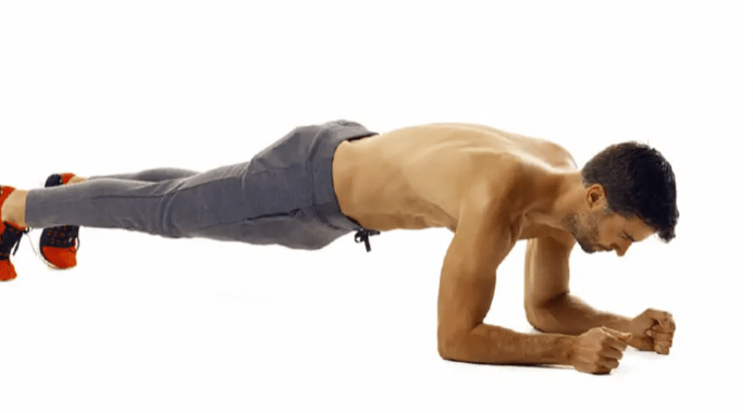 man performing plank exercise as part of a six-week fat-loss plan