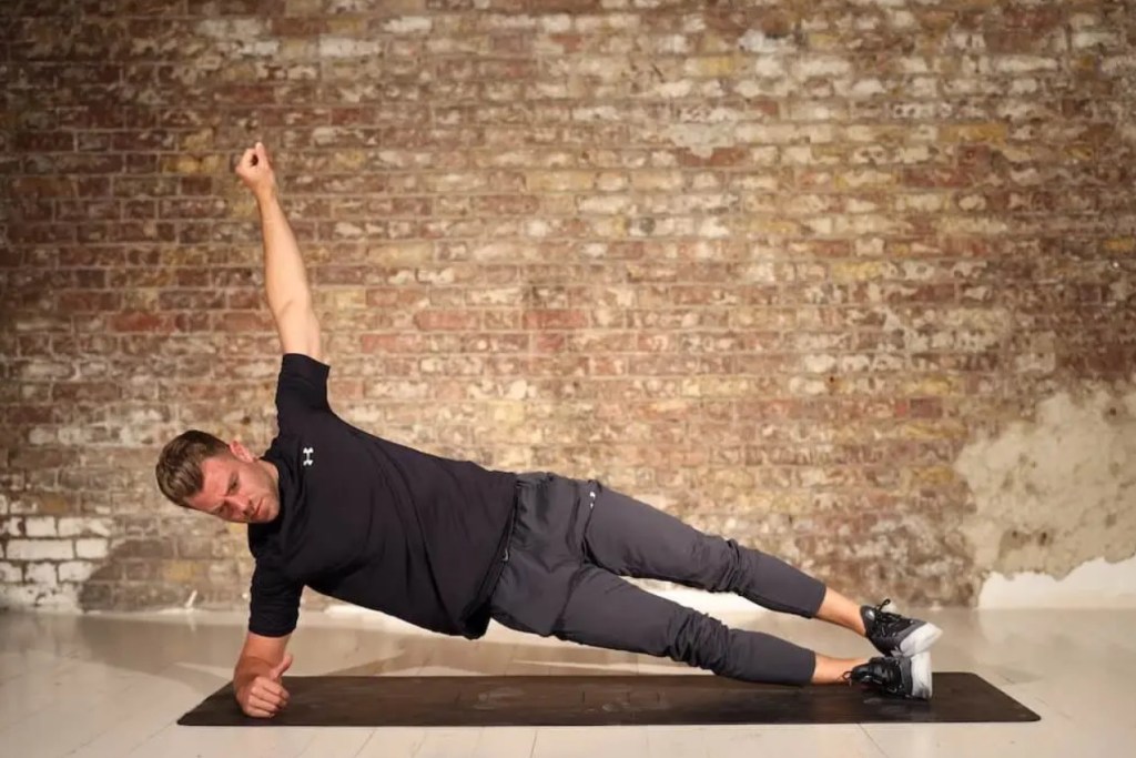 Man performing a side plank exercise